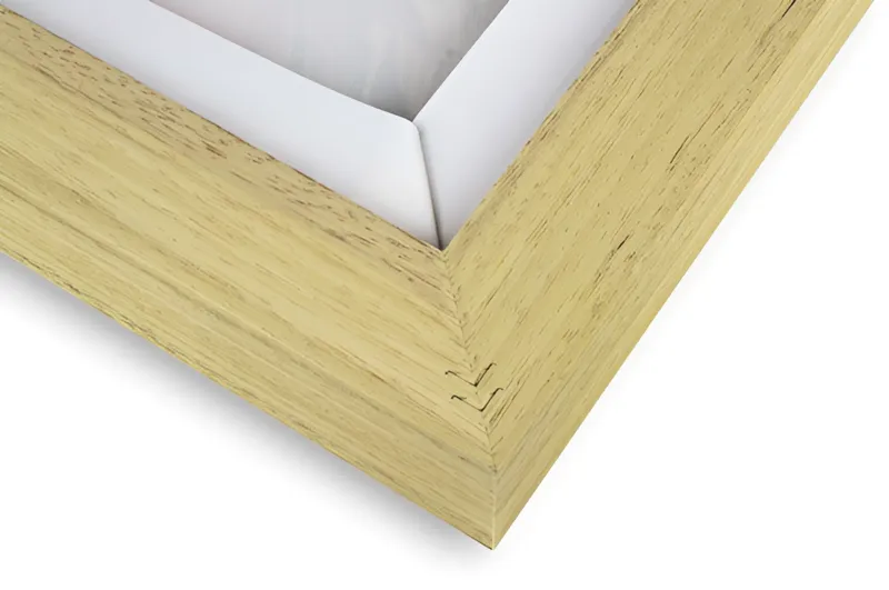 The back corner of a framed canvas: an oak floating frame around the canvas
