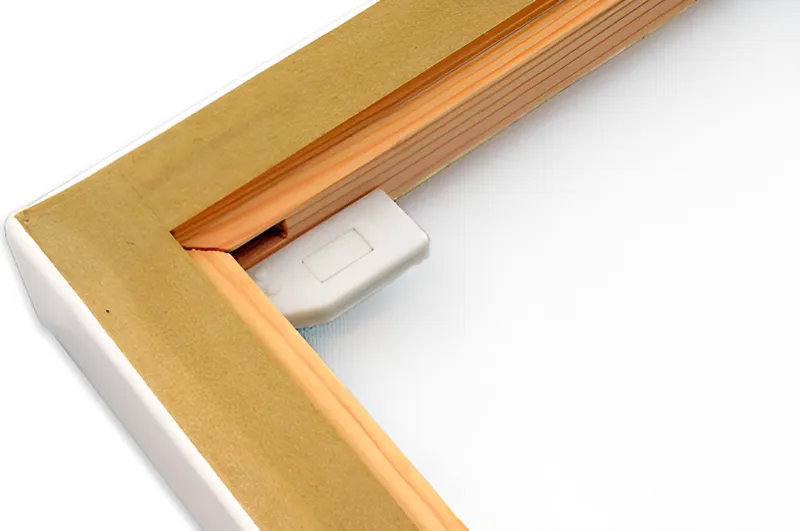 The back corner of a pro canvas: pine stretcher bars with a taped back